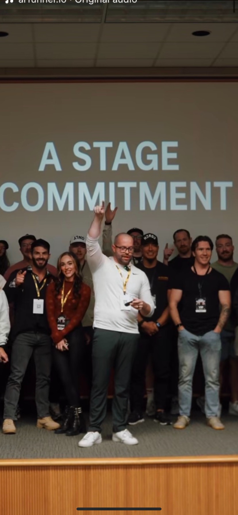 Nick Lambe leading speakers and participants through a stage commitment